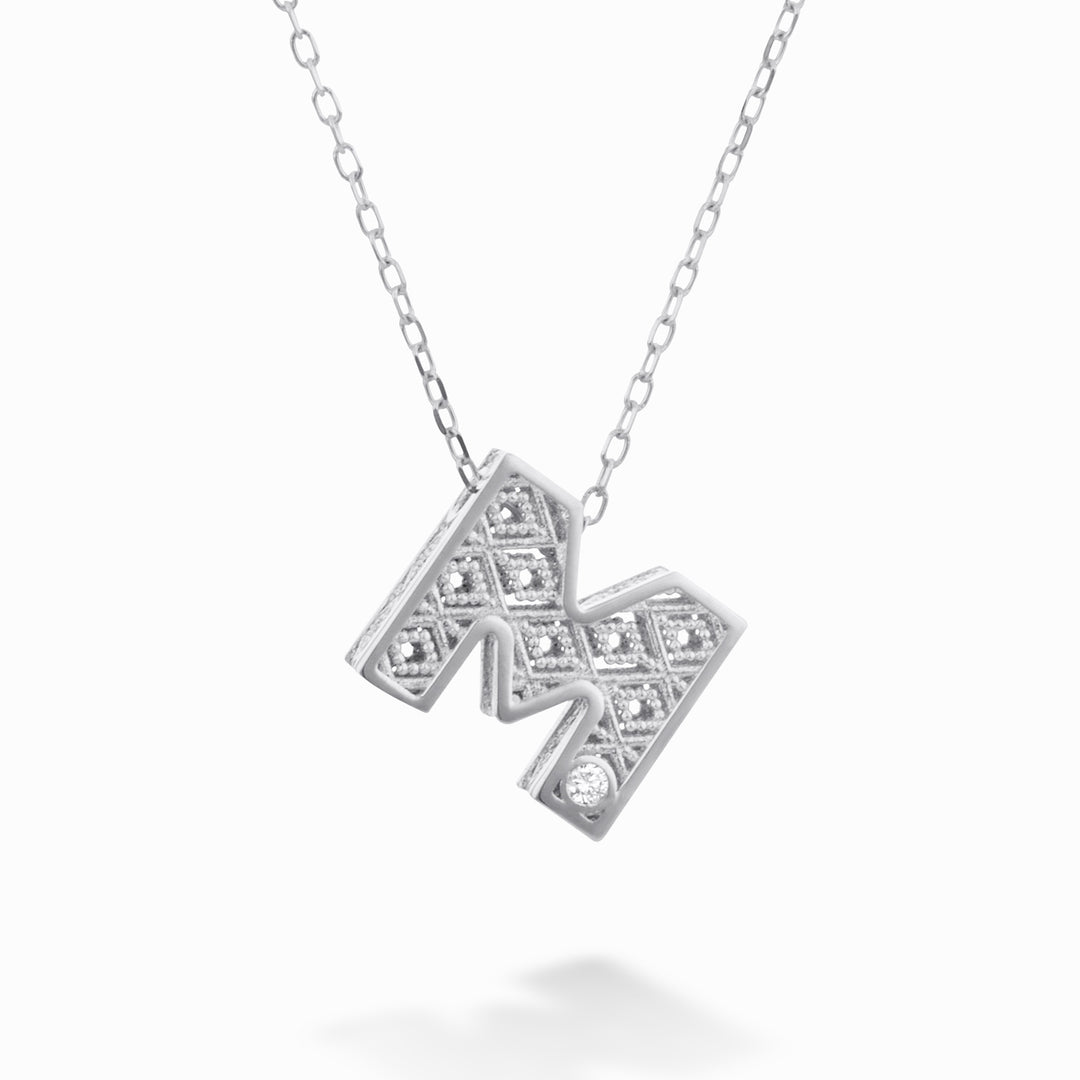 Nihama cl 18k letter m witgoud diam. ct.0,01 NDLETMO4