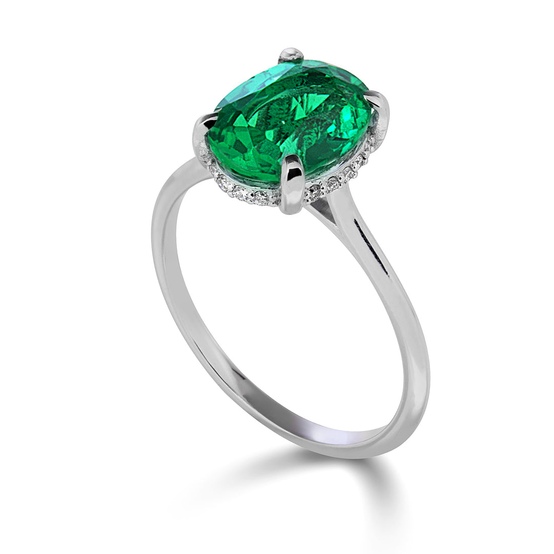 Nihama an 18k oval emerald 10x8 set with diamonds NA5222O4BE