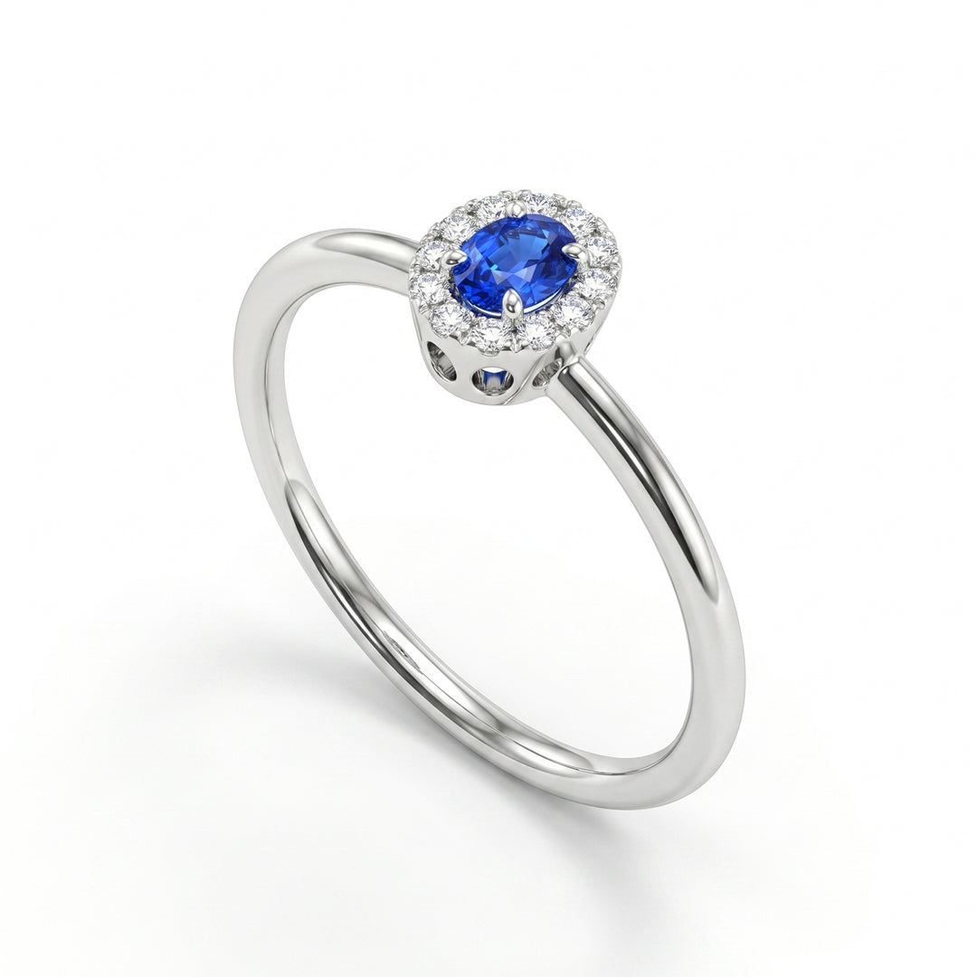 Mikiko an 18k oval sapphire 4x3 with diamond outline and smooth shank MA5233O4ZFN