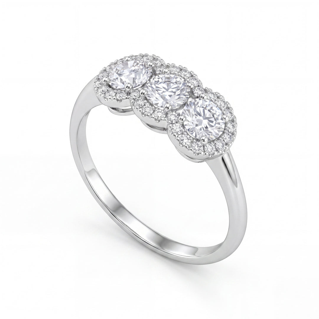 X-Diamond an 18kt trilogy lab g.d. total ct 0.85, cen. ct 0.25x3, shared outline ct 0.15 LXDATRL877O4BI085