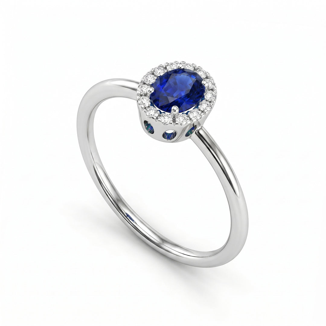 Mikiko an 18k oval sapphire 5x4 with diamond outline and smooth shank MA5234O4ZFD
